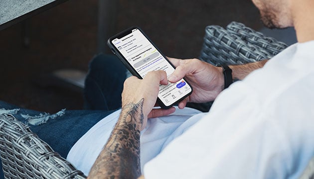 Patient using his mobile device to find a pharmacy