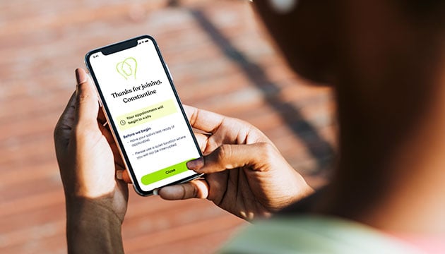 User using phone to schedule an appointment